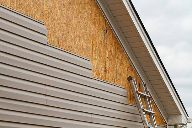 Professional Emergency Siding Repair technician working in Lake City, PA